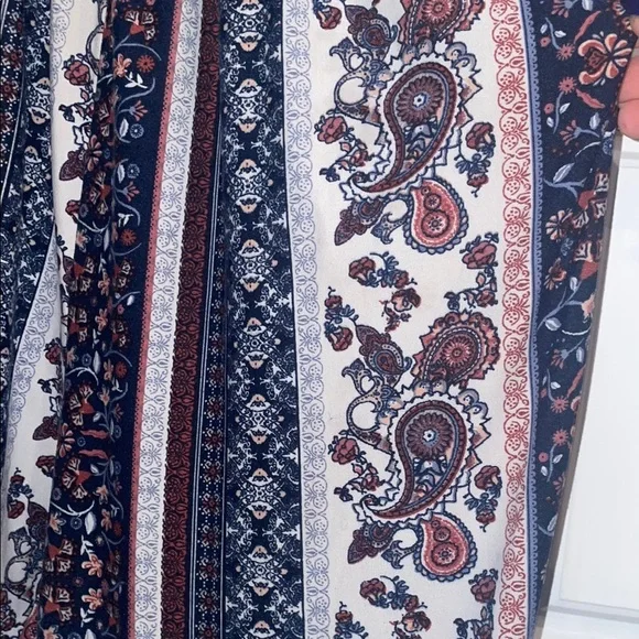 Elegant Blue and Cream Striped Jumpsuit with High Neckline - Picture 4 of 5